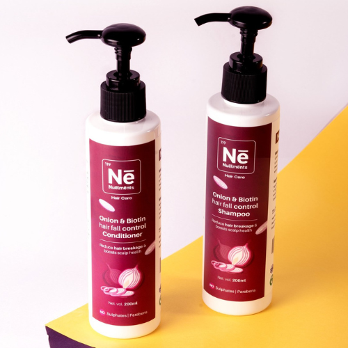 Nuelments Onion & Biotin Conditioner for reducing hair fall, promoting growth, and detangling hair without sulfates.